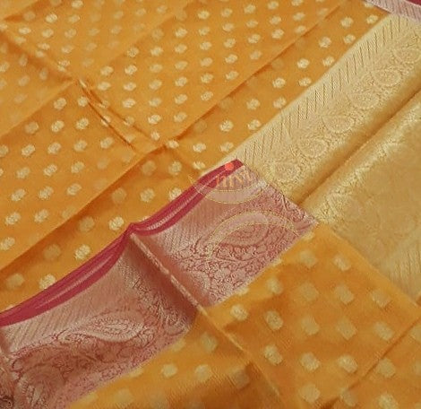Orange  silk cotton benaras brocade with antique zari motifs The saree comes with blouse piece.