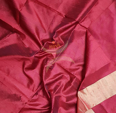 Red handloom raw silk blouse piece with gold border.