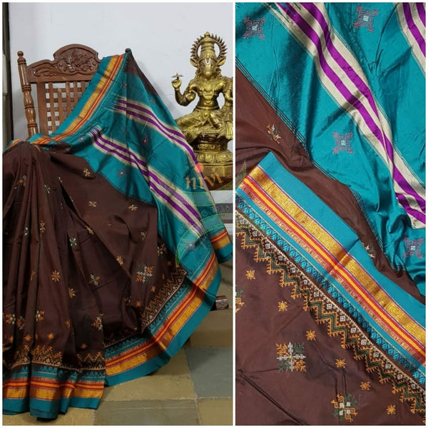 Brown ilkal silk cotton with blue border and geometric motif kasuti embroidery.