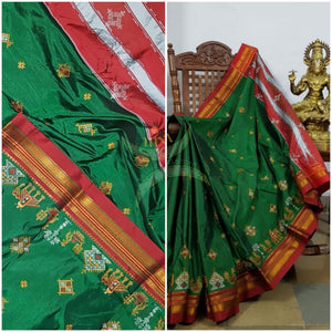 Green ilkal silk cotton with red border and anne ambari motif kasuti embroidery.
