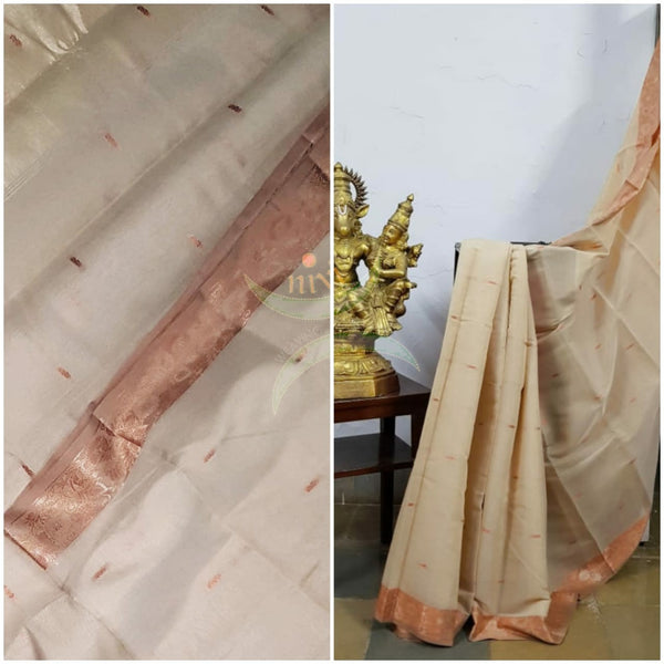 Beige cotton blend 1000 butta saree with tissue pallu.