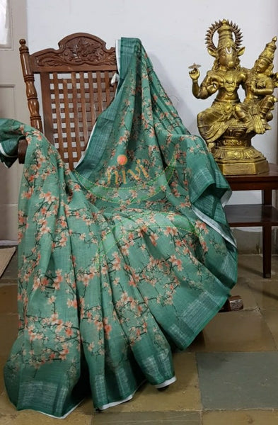 Sea green digital printed linen saree.