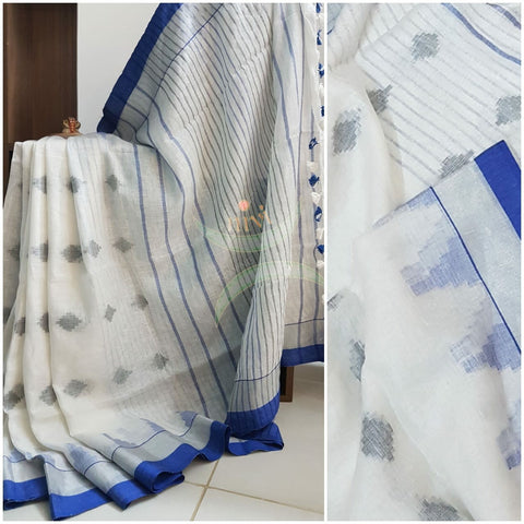 White handloom linen with blue jamdani woven motifs.