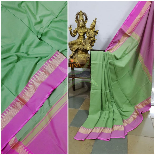 Pastel green handloom cotton soft drape with contrasting pink temple border, pallu and blouse.