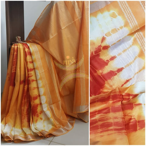 White and orange shibori linen