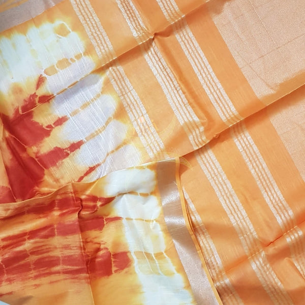 White and orange shibori linen