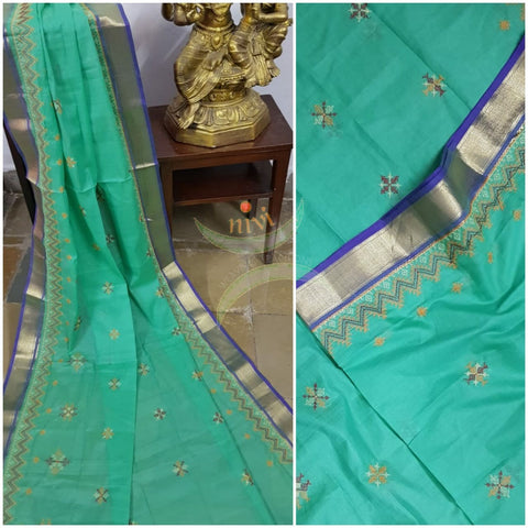 Sea green kota cotton dupatta with machine kasuti embroidery.
