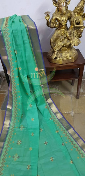 Sea green kota cotton dupatta with machine kasuti embroidery.