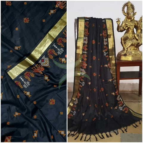 Black kota cotton dupatta with machine kasuti embroidery.