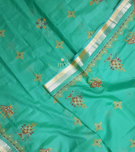 Sea green kota cotton dupatta with machine kasuti embroidery.