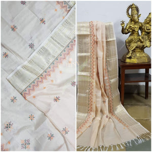 Beige kota cotton dupatta with machine kasuti embroidery.
