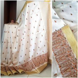 Off white art silk tussar with kashida embroidery.