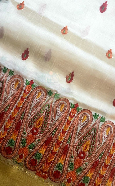 Off white art silk tussar with kashida embroidery.