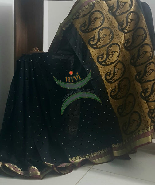 Black art silk blend Saree with brocade woven pallu and blouse.