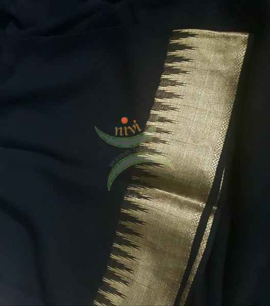 Black pure silk georgette with Matt gold temple border and striped pallu.