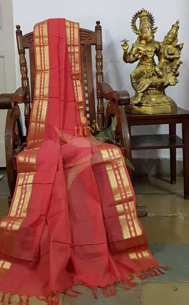 Dark peach kota cotton dupatta with subtle gold borders.