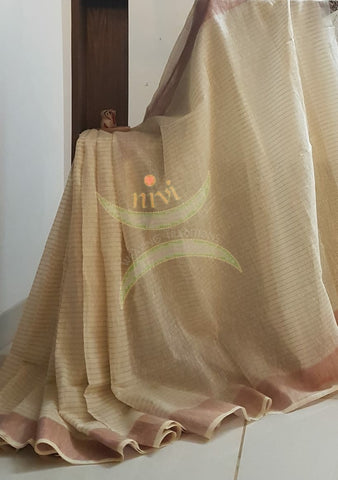 Off white handloom linen cotton with contrasting pink border and blouse piece.