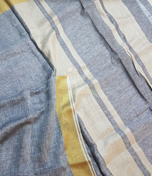 Grey handloom linen cotton with contrasting gold border and blouse piece.