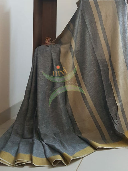 Grey handloom linen cotton with contrasting gold border and blouse piece.