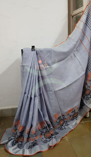Grey handloom linen with contrasting orange border woven with floral motif and striped pallu