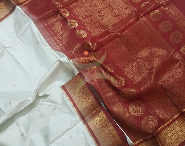 Off white handloom pure silk kanjeevaram with contrasting red border and pallu