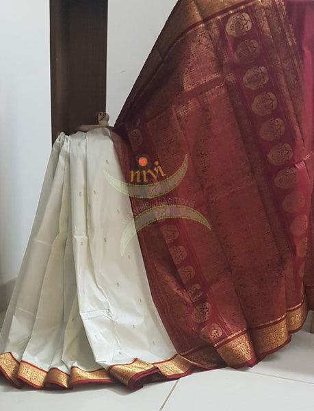 Off white handloom pure silk kanjeevaram with contrasting red border and pallu