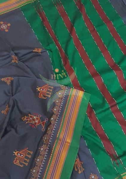 Grey silk cotton ilkal with traditional anne ambari motif kasuti embroidery and Green tope teni pallu.