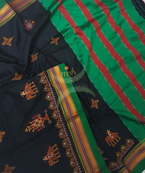 Black silk cotton ilkal with traditional anne ambari motif kasuti embroidery and Green tope teni pallu. Saree comes with running blouse.