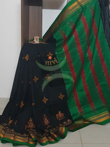 Black silk cotton ilkal with traditional anne ambari motif kasuti embroidery and Green tope teni pallu. Saree comes with running blouse.