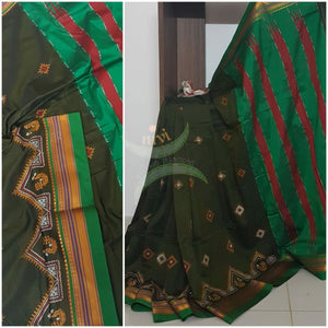 Mehendi green silk cotton ilkal with traditional peacock motif kasuti embroidery and Green tope teni pallu. Saree comes with running blouse.