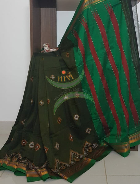 Mehendi green silk cotton ilkal with traditional peacock motif kasuti embroidery and Green tope teni pallu. Saree comes with running blouse.