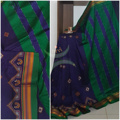 Royal blue silk cotton ilkal with traditional peacock motif kasuti embroidery and Green tope teni pallu. Saree comes with running blouse.