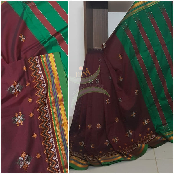Maroon silk cotton ilkal with traditional motif kasuti embroidery and Green tope teni pallu. Saree comes with running blouse.