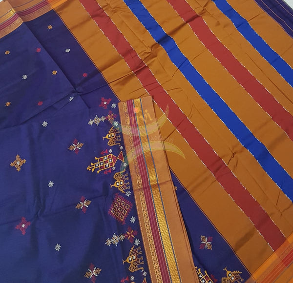 Royal blue cotton blended ilkal with traditional anne ambari motif kasuti embroidery and mustard tope teni pallu. Saree comes with running blouse.