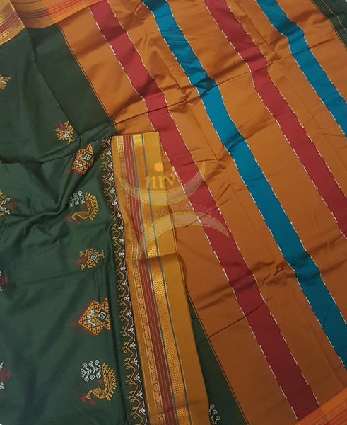 Mehendi green cotton blended  ilkal with traditional gopura motif kasuti embroidery and mustard tope teni pallu. Saree comes with running blouse.