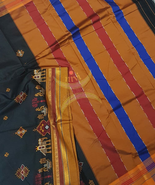 Black cotton blended  ilkal with traditional anne ambari gopura motif kasuti embroidery and mustard tope teni pallu. Saree comes with running blouse.