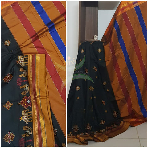 Black cotton blended  ilkal with traditional anne ambari gopura motif kasuti embroidery and mustard tope teni pallu. Saree comes with running blouse.