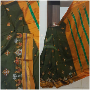 Mehendi green  silk cotton ilkal with traditional anne ambari gopura motif kasuti embroidery and mustard tope teni pallu. Saree comes with running blouse.