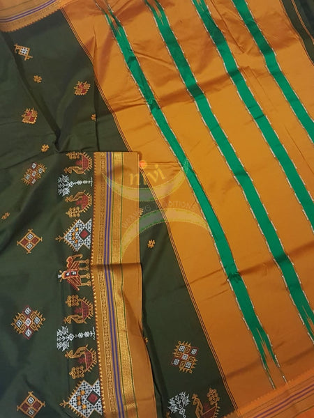 Mehendi green  silk cotton ilkal with traditional anne ambari gopura motif kasuti embroidery and mustard tope teni pallu. Saree comes with running blouse.