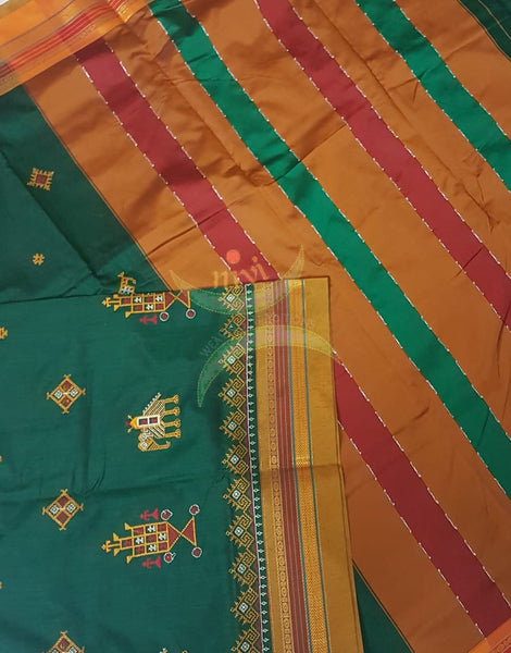 Green cotton blended ilkal with traditional anne ambari motif kasuti embroidery and mustard tope teni pallu. Saree comes with running blouse.