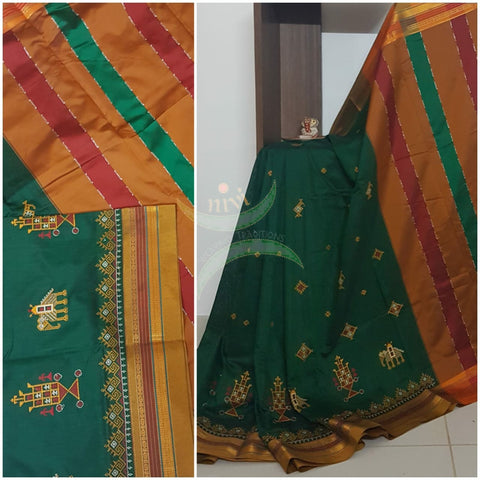Green cotton blended ilkal with traditional anne ambari motif kasuti embroidery and mustard tope teni pallu. Saree comes with running blouse.