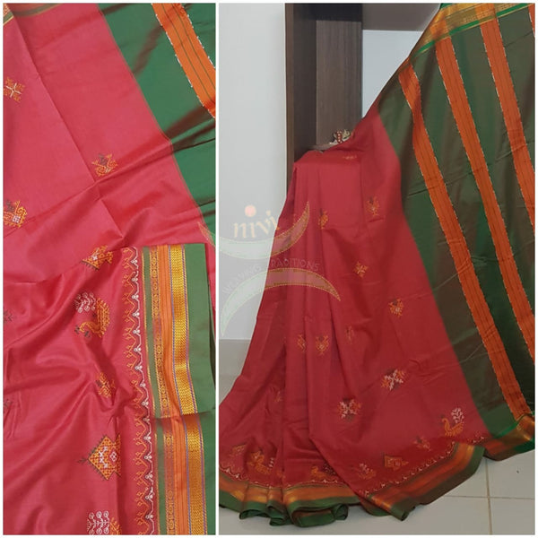 Red cotton blended ilkal with traditional gopura motif kasuti embroidery and green tope teni pallu. Saree comes with running blouse.