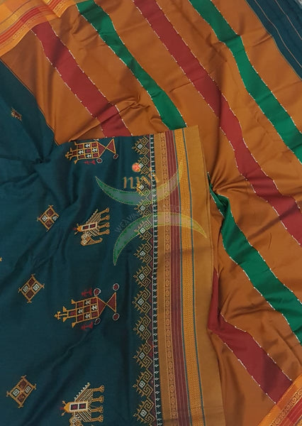 Teal cotton blended ilkal with traditional anne ambari motif kasuti embroidery and mustard tope teni pallu. Saree comes with running blouse.