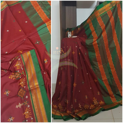 Maroon cotton blended ilkal with traditional anne ambari motif kasuti embroidery and green tope teni pallu. Saree comes with running blouse.