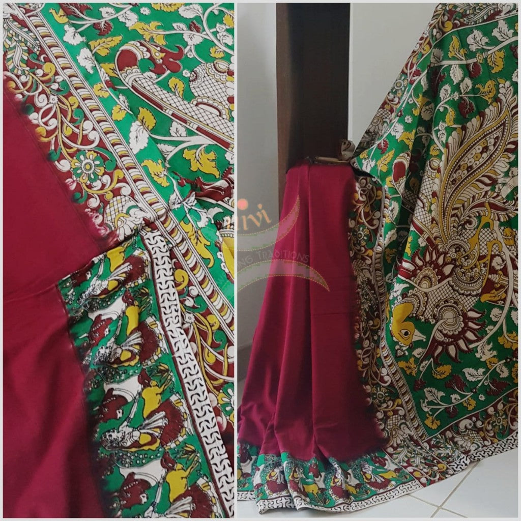 Red mul cotton handloom kalamkari Saree with human figure motifs on border and peacock motif on pallu. Saree comes with kalamkari printed blouse piece.