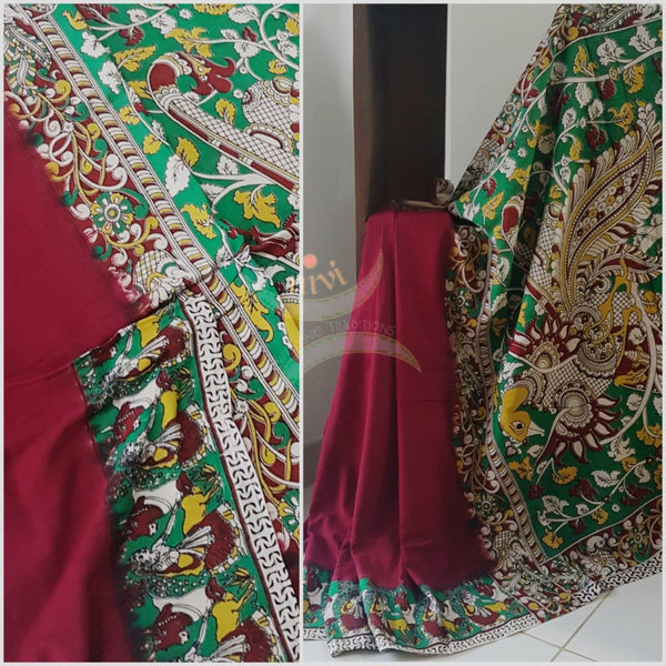 Red mul cotton handloom kalamkari Saree with human figure motifs on border and peacock motif on pallu. Saree comes with kalamkari printed blouse piece.
