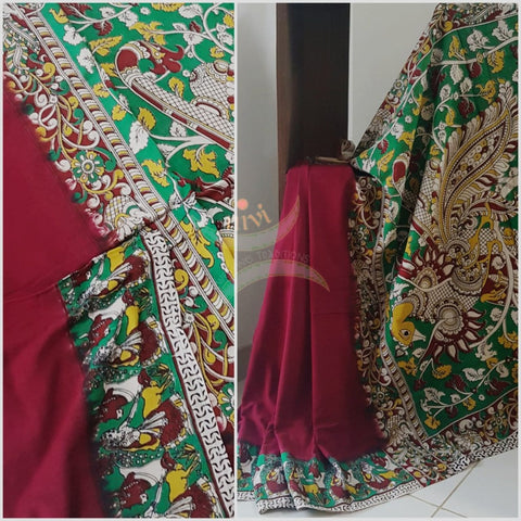 Red mul cotton handloom kalamkari Saree with human figure motifs on border and peacock motif on pallu. Saree comes with kalamkari printed blouse piece.