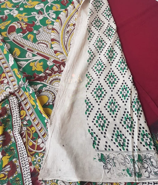 Red mul cotton handloom kalamkari Saree with human figure motifs on border and peacock motif on pallu. Saree comes with kalamkari printed blouse piece.