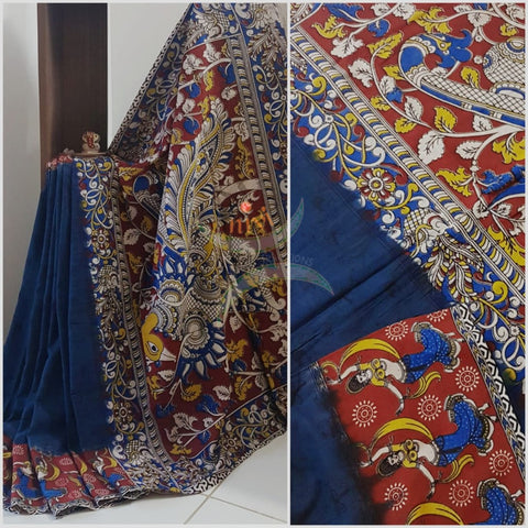 Teal mul cotton handloom kalamkari Saree with human figure motifs on border and peacock motif on pallu. Saree comes with kalamkari printed blouse piece.