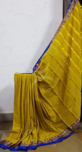 Yellowish green mercerised South cotton with contrasting blue woven temple border